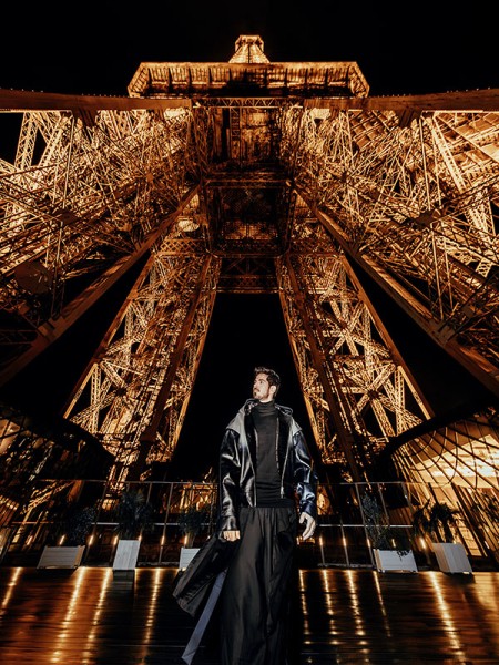Photo of Michael Canitrot beneath the Eiffel Tower